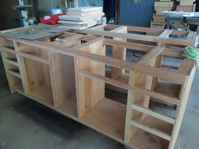 The bathroom vanity frames are in process.